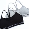 image:imageReebok Girls Training Bras  2 Pack Racerback Bralettes Removable Pads  SuperSoft Fabric with a Sporty RacerStyle Back Fit Stays Comfortably in Place Through Dance Gym and PlayBlackGrey