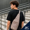image:imageReebok Unisex Convertible Crossbody Sling Bag for Women amp Men Compact  Adjustable Strap for Vesatile Carry Organized Pockets for Phone Keys amp Wallet Durable Hardware Everyday Daily Carry or GyCosmos Mocha