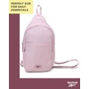 image:imageReebok Unisex Convertible Crossbody Sling Bag for Women amp Men Compact  Adjustable Strap for Vesatile Carry Organized Pockets for Phone Keys amp Wallet Durable Hardware Everyday Daily Carry or GyThea II Ashen Lilac