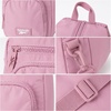 image:imageReebok Unisex Convertible Crossbody Sling Bag for Women amp Men Compact  Adjustable Strap for Vesatile Carry Organized Pockets for Phone Keys amp Wallet Durable Hardware Everyday Daily Carry or GyCosmos Infused Lilac