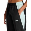 image:imageReebok Womens Bv Woven Pant Standard Fit 29 Inseam Lightweight Nylon Crinkle Woven FabricBlackGlitch Aqua