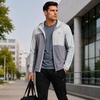 image:imageReebok Mens Lightweight FleeceLined Softshell Jacket Wind Resistant Hood  Wind and Water Resistant Shell for Daily Commutes or Travel Streamlined Athletic Cut Protective Collar for Chilly MorningsPale Grey