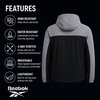 image:imageReebok Mens Lightweight FleeceLined Softshell Jacket Wind Resistant Hood  Wind and Water Resistant Shell for Daily Commutes or Travel Streamlined Athletic Cut Protective Collar for Chilly MorningsGrey