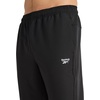 image:imageReebok Mens Repeat Woven Pant Standard Fit 30 Inseam Lightweight Stretch PolyBlend FabricBlack