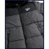 image:imageReebok Mens Winter Jacket  Heavyweight Insulated Puffer Jacket with Hood  Wind and Water Resistant Fabric Blocks Chill Sturdy FullZip Closure for Easy Layering Versatile Everyday StyleCharcoal Grey Ash