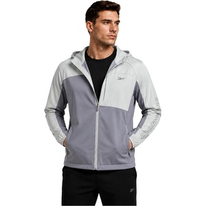 image:imageReebok Mens Lightweight FleeceLined Softshell Jacket Wind Resistant Hood  Wind and Water Resistant Shell for Daily Commutes or Travel Streamlined Athletic Cut Protective Collar for Chilly MorningsPale Grey