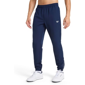 image:imageReebok Mens Repeat Woven Pant Standard Fit 30 Inseam Lightweight Stretch PolyBlend FabricVector Navy